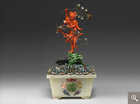 Planter with a coral carving of the planetary deity Kuixing