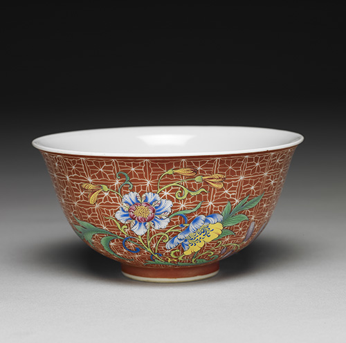 Porcelain teacup with flowers and golden fish on a red ground in falangcai painted enamels