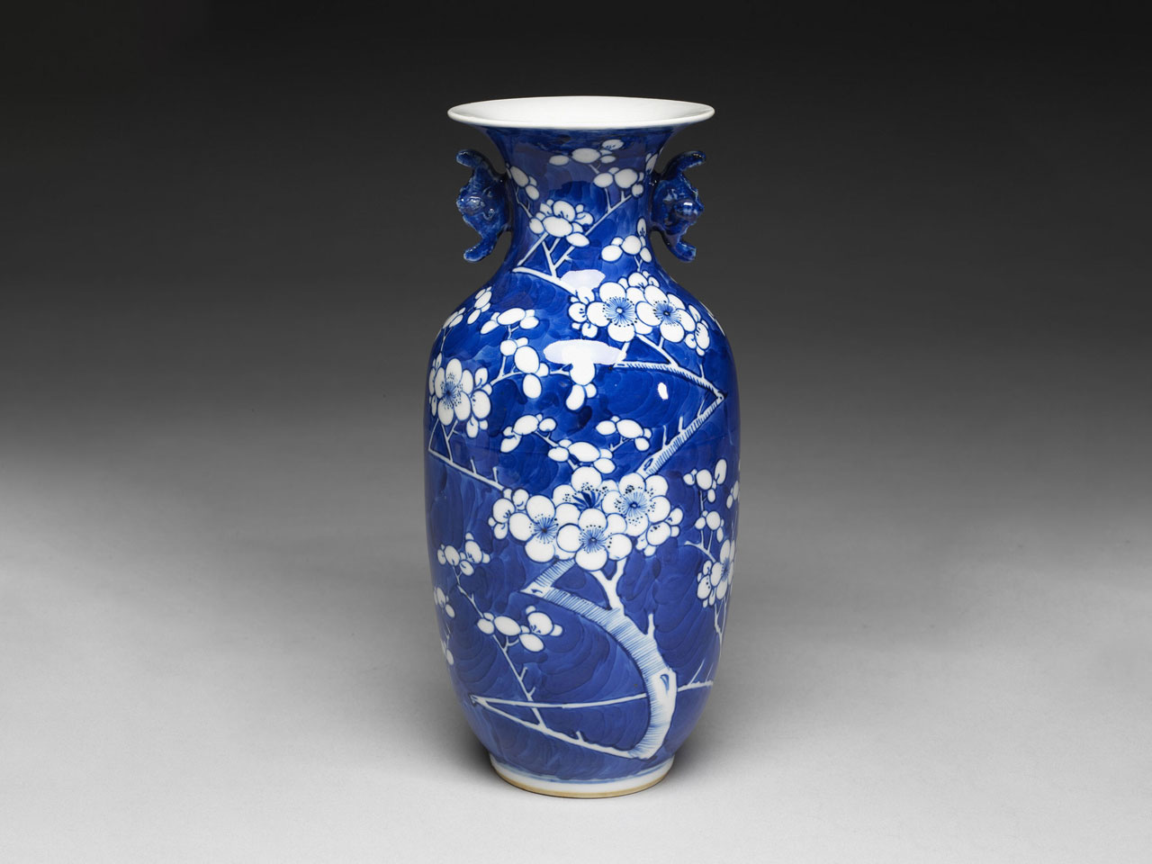 Vase with bat-shaped handles and white plum-blossom decoration on a blue glaze ground