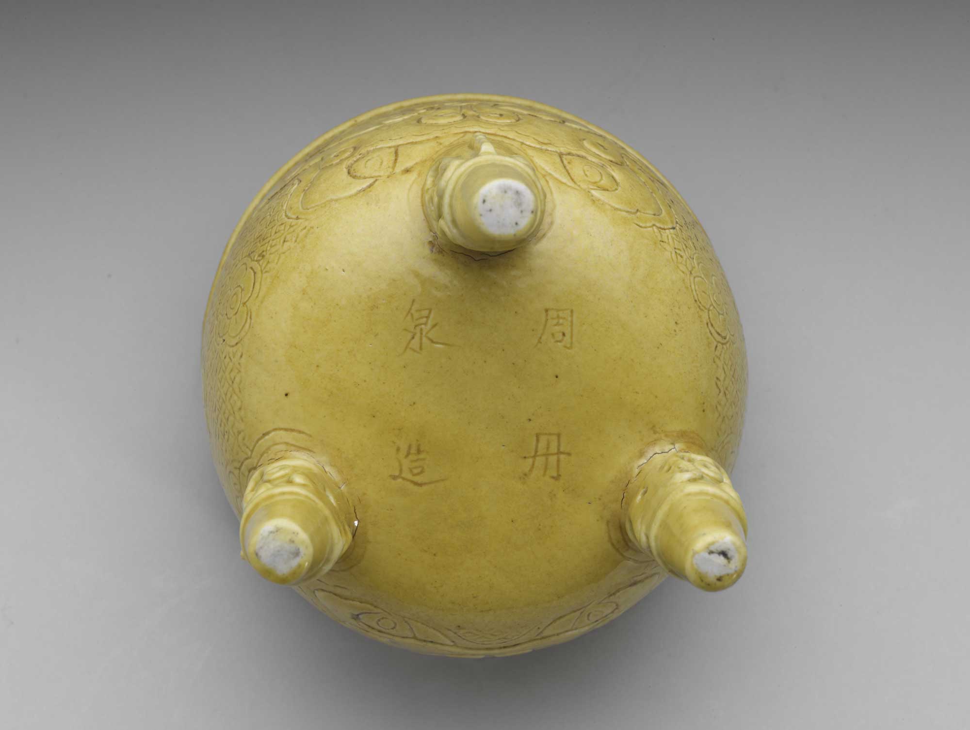 Porcelain Tripod with Animal-mask Design and Arch Handles in Yellow glaze