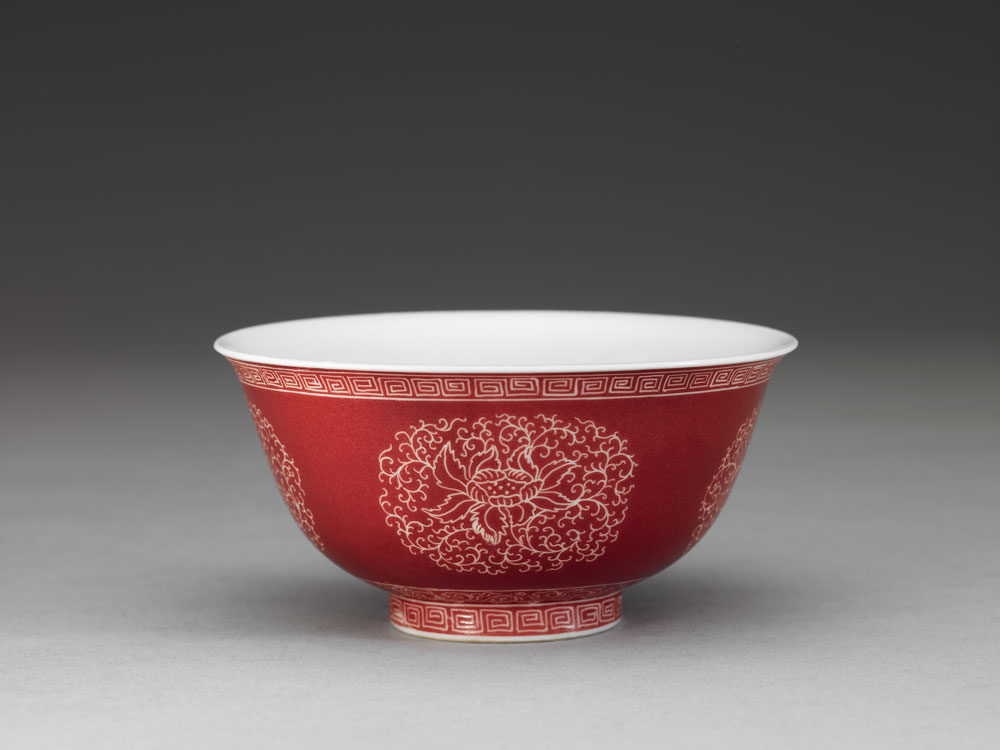 Bowl with flower brocade carved on a red ground in falangcai painted enamels