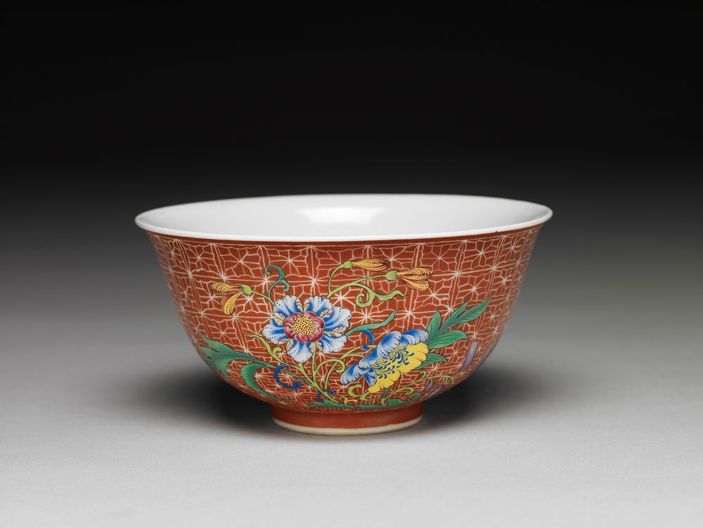 Tea bowl with flower and aquatic plants on a carved red ground in falangcai painted enamels