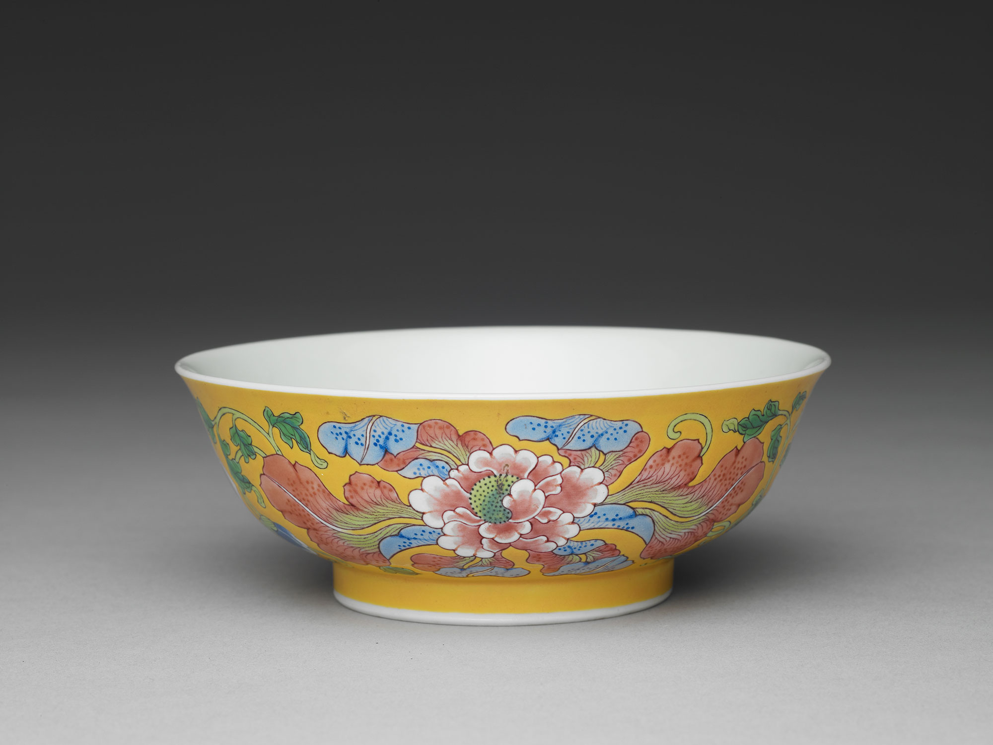 Bowl with peonies on a yellow ground in painted enamels