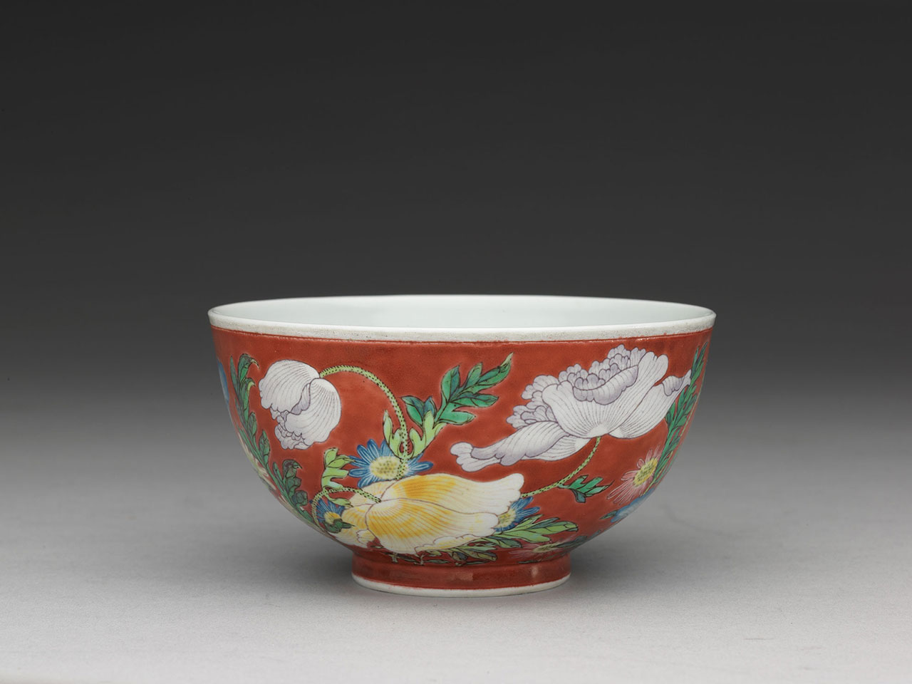 Bowl with poppies on a red ground in painted enamels