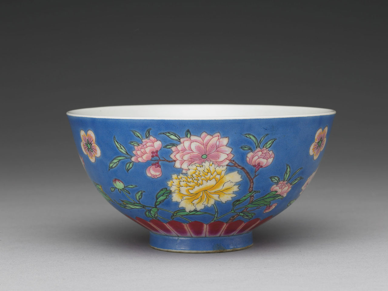 Bowl with flowers of the four seasons on a blue ground in painted enamels