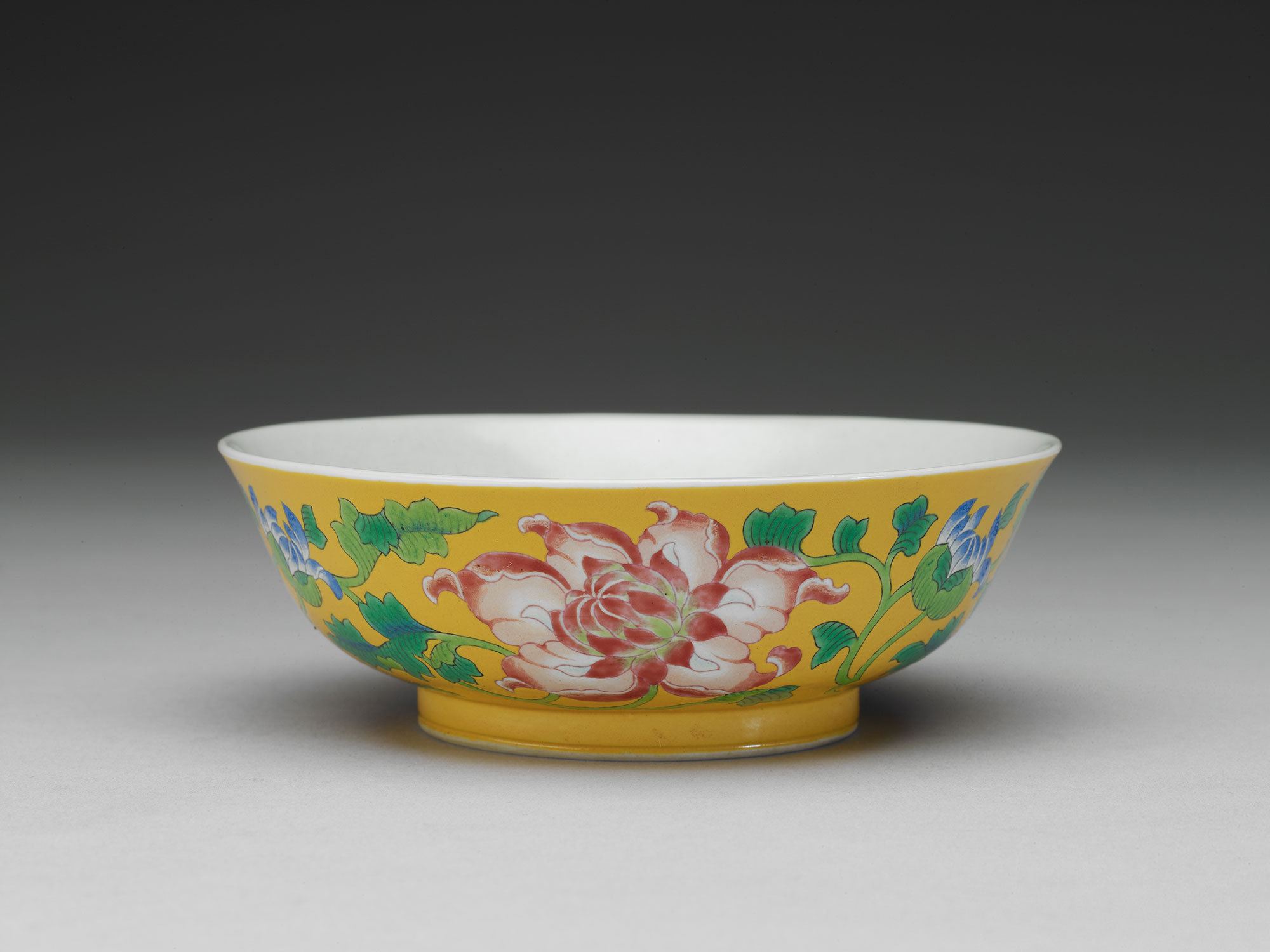 Bowl with flowers on a yellow ground in painted enamels