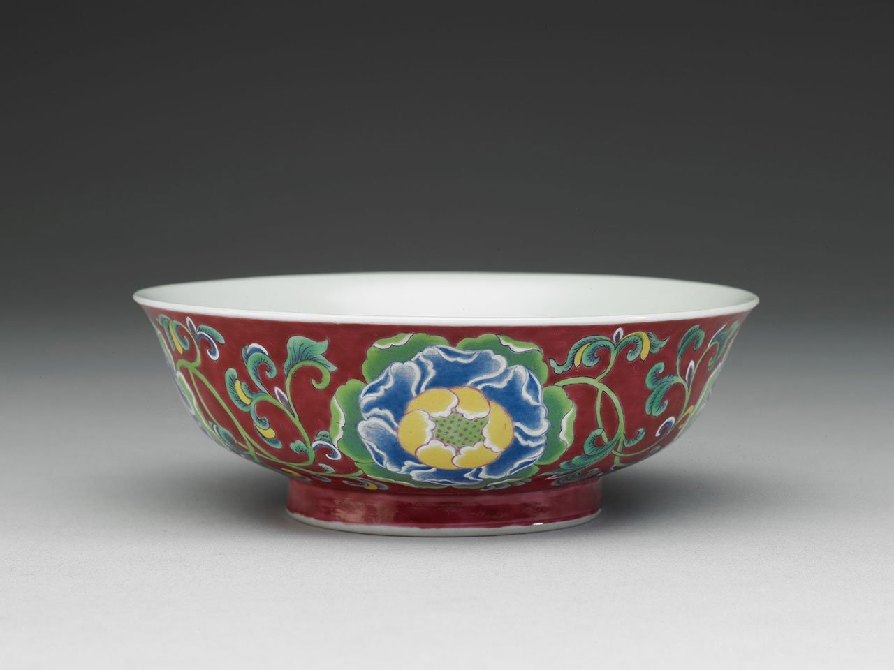 Bowl with peonies on a red ground in painted enamels
