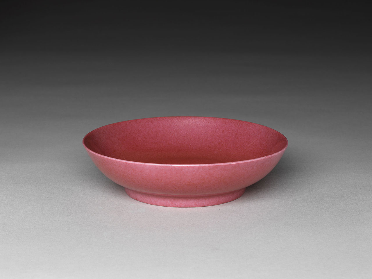Saucer with rouge glaze