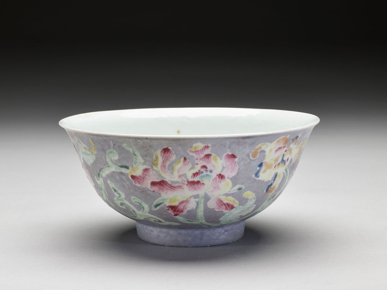Bowl with flowers on a light-purple ground