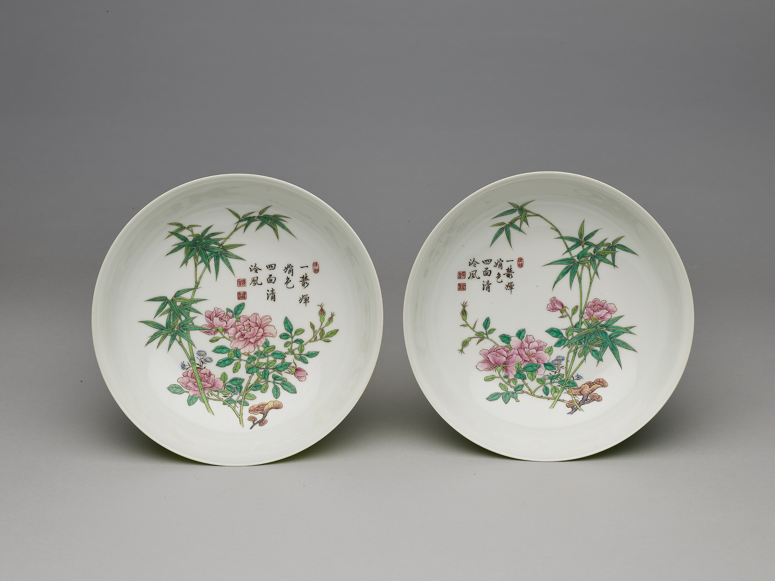 Dish with flower and bamboo inside a carved green exterior in falangcai painted enamels