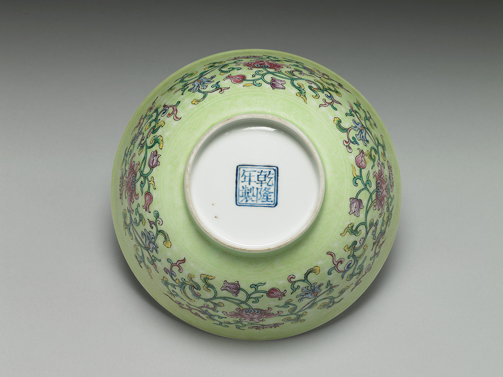 Bowl with Indian lotus on a carved green ground in falangcai painted enamels