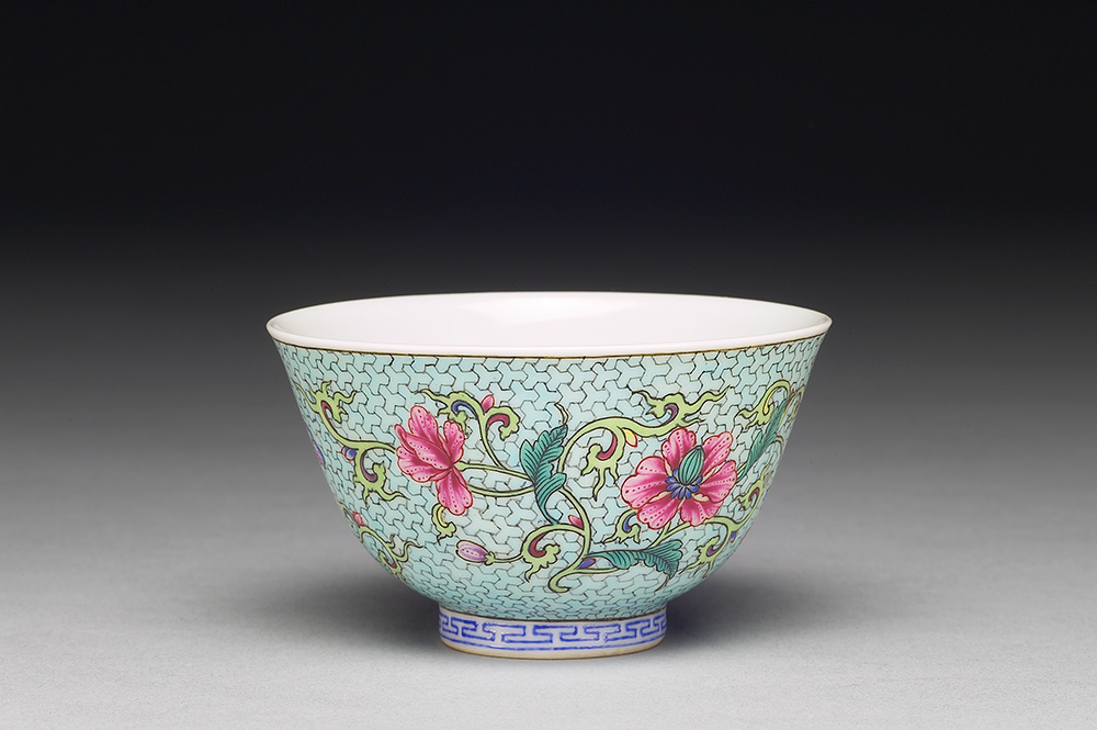 Zhong wine cup with flower on a polychrome light green ground in falangcai painted enamels