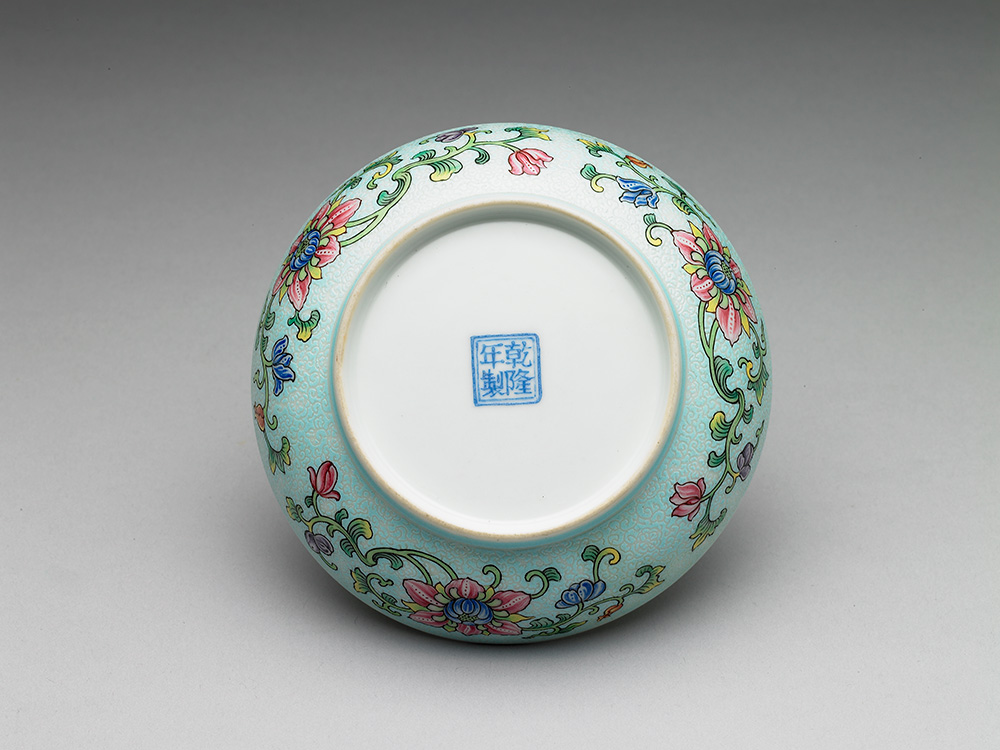 Dish with antique and flower inside a carved polychrome blue exterior in falangcai painted enamels