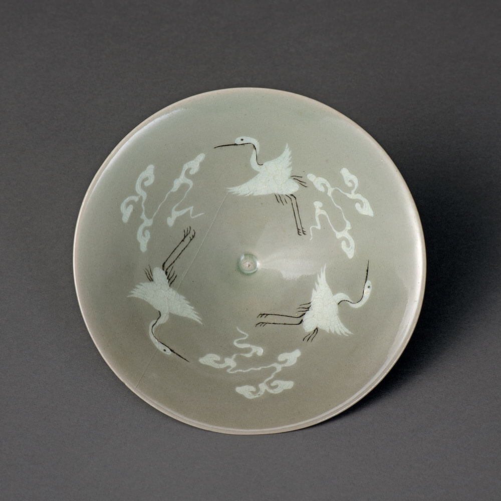 Bowl with inlaid cloud and crane design against celadon glaze_preview