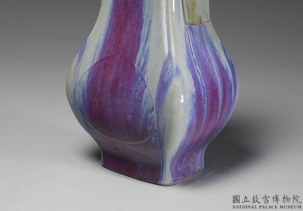 Vase with tubular handles and apricot leaf decoration in glaze