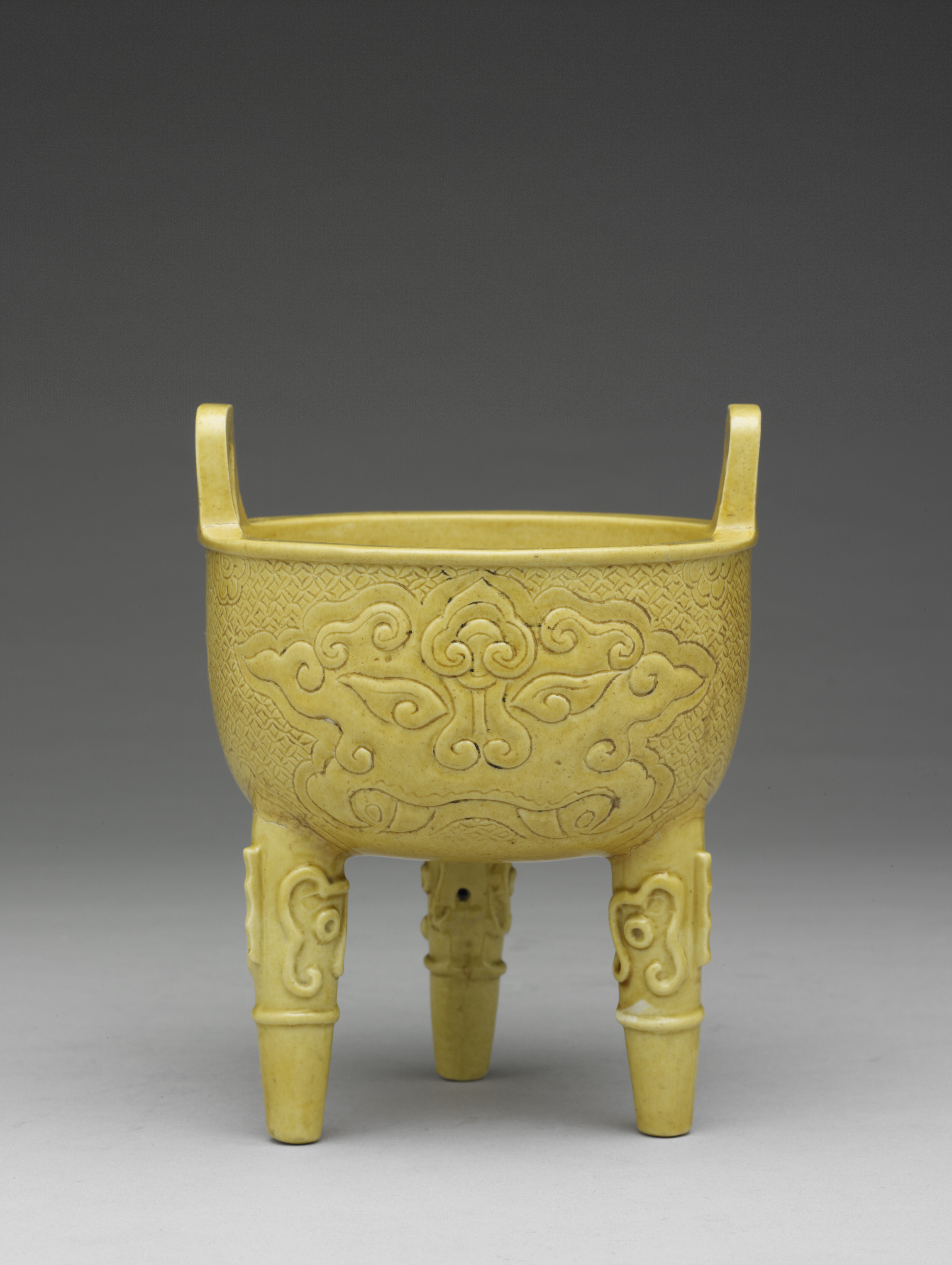 Bright Yellow Ting with Animal-mask Patterns in Relief