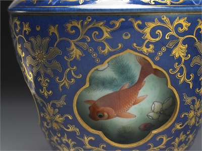 Revolving vase with swimming fish in cobalt blue glaze