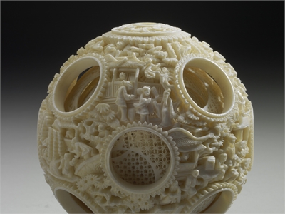 Ivory balls of nested concentric layers with human figures in openwork relief